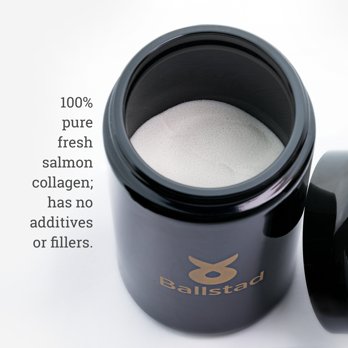 Black container with white powder labeled &