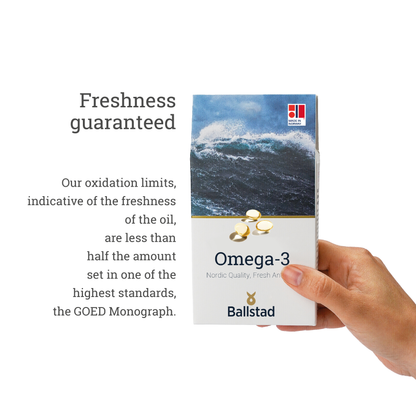 Ballstad Omega-3 supplement box held by a hand with text about freshness guarantee.